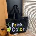 Casual black canvas tote bag featuring colorful embroidered letters for daily use. - With Pendant / Black