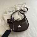 Stylish dark brown crescent hobo bag with matching mini pouch and adjustable strap - Coffee