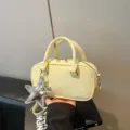 Yellow bowling-style pillow bag with silver star charm and crossbody strap - With Pendant / Yellow