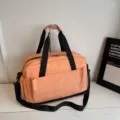 Large capacity travel duffel bag orange gym sports bag with shoulder strap for short trips. - Pink