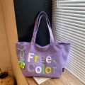 Purple canvas tote bag casual shoulder bag with stylish letter embroidery and cute charm pendant. - With Pendant / Purple