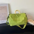 Large capacity green travel duffel bag with shoulder strap, perfect for fitness and short trips. - Green