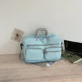 Large capacity travel duffel bag with multiple pockets and comfortable handles for short trips. - Light Blue