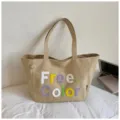 Casual canvas tote bag with stylish embroidered letter design, perfect for daily travel and work. - No Pendant / Khaki