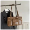 Vintage large capacity brown glossy shoulder bag with belt detail for office commute - Khaki