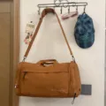 Brown large capacity travel duffel bag with shoulder strap, ideal for short trips and gym use. - Brown