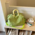 Large capacity travel duffel bag, green waterproof gym bag with yellow handles and strap. - Green