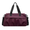 Large capacity travel duffel bag in wine red with sturdy black straps for gym and trips. - Purple