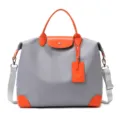 Sac de voyage gris et orange avec bandoulière, sac à main étanche et élégant. - Gris Orange