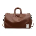 Braune Reisetasche aus Leder mit Schultergurt, stylische Weekender Sporttasche für Damen Herren. - Braun