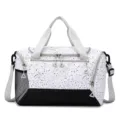 Spacious travel gym duffel bag with splash ink print, durable grey handles, and black base. - White