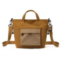 Casual brown canvas tote bag, large capacity commute shoulder bag with grid front pocket. - Caramel color