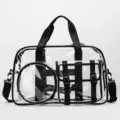 Clear PVC gym bag, transparent waterproof travel tote with black straps and multiple pockets. - Black