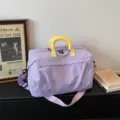 Large capacity travel duffel bag with separate wet pocket and yellow handles in lavender. - Purple