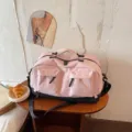 Large capacity pink travel duffel bag with shoe compartment, perfect for gym and weekend trips. - Pink