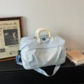 Light blue travel duffel bag large capacity fitness gym bag with white handle and shoulder strap. - Light Blue