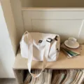 Minimalist beige canvas duffel bag, large capacity travel tote and casual gym shoulder bag. - Off White