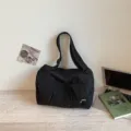 Minimalist black travel shoulder bag, large capacity canvas weekender for daily casual use. - Black