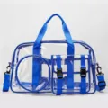 Clear waterproof gym duffel bag with blue straps and front pockets for travel and beach use. - Blue