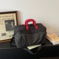 Large capacity travel duffel bag with red handles, perfect for short trips, gym and daily outdoor use. - Black