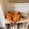 Orange lightweight crossbody duffel bag, casual travel fitness storage bag for short trips. - Orange