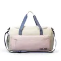 Canvas gym duffel bag in off-white with blue straps and pink front pocket for travel. - Pink with Label