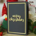 Elegante tarjeta de Navidad negra con letras doradas de merry christmas en relieve fino - Tarjeta Negra Bronceado (Merry Christmas)