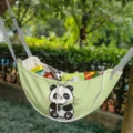Light green multi-functional car seat back storage bag featuring a cute cartoon panda print. - Panda Hugging Bamboo / 60*37*30cm