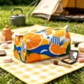 Detailed view of the orange slice pattern on the travel velvet makeup bag - Small (15.5*7.5*7.5cm) / Blue Wave Orange
