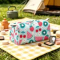 Outdoor picnic detail showing a fruit pattern travel cosmetic bag with zipper closure - Small (15.5*7.5*7.5cm) / Light Blue Fruit