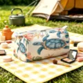 Detailed view of turtle print flannel makeup bag in an outdoor camping setting - L / Cream Sea Turtle Starfish Print (02)