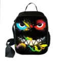 Macro detail view of vibrant monster face graffiti print on a portable insulated lunch bag - Monster Graffiti Style 06