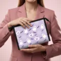Purple Halloween cosmetic pouch featuring ghost and pumpkin prints, held by a model - 23*8.5*16.5cm / Lavender Festive Elements