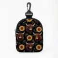 Portable coin purse with Highland cow and sunflower pattern and black carabiner clip - Oval Black Base Highland Cow Sunflower (07)