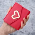 Vibrant red faux leather coin purse with gold heart clasp, compact heart card holder variant. - Red