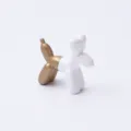 Resin balloon dog figurine in white and gold, modern desktop ornament for home decor. - Gold + White