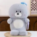 Muñeca de foca de peluche gris con bonito gorro de dormir azul y mochila, suave peluche para niños. - León marino (modelo pingüino con mochila) / 25cm