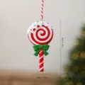 Handcrafted resin Christmas lollipop ornament with red white swirl and green bow - Bow Lollipop