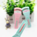 Portable ABS eyelash curler with built-in comb plastic mini curling tool for daily makeup - Green