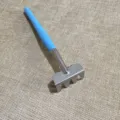Mini garden metal rake detail view with blue plastic handle for plant care and potting. - Single Hand Rake