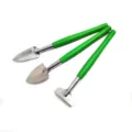 Miniature garden tools detail view showing metal shovel and green plastic handle. - Three-Piece Set / Green