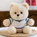 Cute plush bear toy in striped sweater, soft stuffed animal doll for girls birthday gifts. - College Sweater Style / Beige
