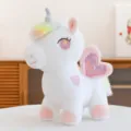 Adorabile peluche unicorno arcobaleno con ali a cuore rosa e morbida imbottitura per regalo. - Rosa da Sogno / 23cm