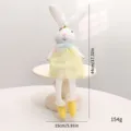White Easter bunny plush doll wearing a yellow floral dress for holiday decoration - Sitting Bunny with Dangling Legs - Yellow