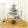 85cm Flocked artificial Christmas tree decorated with pine cones and a moss base - 85cm / Moss Base Snow Green