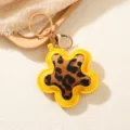 Flower shaped leopard print keychain in yellow PU leather with gold clasp for women bag - Flower