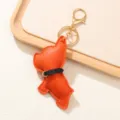 Adorable llavero de Bulldog Francés de cuero naranja con anillo de metal dorado - Naranja