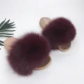 Close-up of plush burgundy raccoon fur slippers with durable PVC soles - 36 / Gold with Burgundy