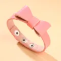 Bracelet nœud en cuir PU rose élégant avec fermeture à bouton-pression réglable - Rose