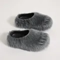 Detailed view of grey faux fur claw slippers with silver spikes and platform sole - Gray
